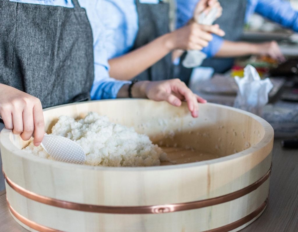 Woman works with rice