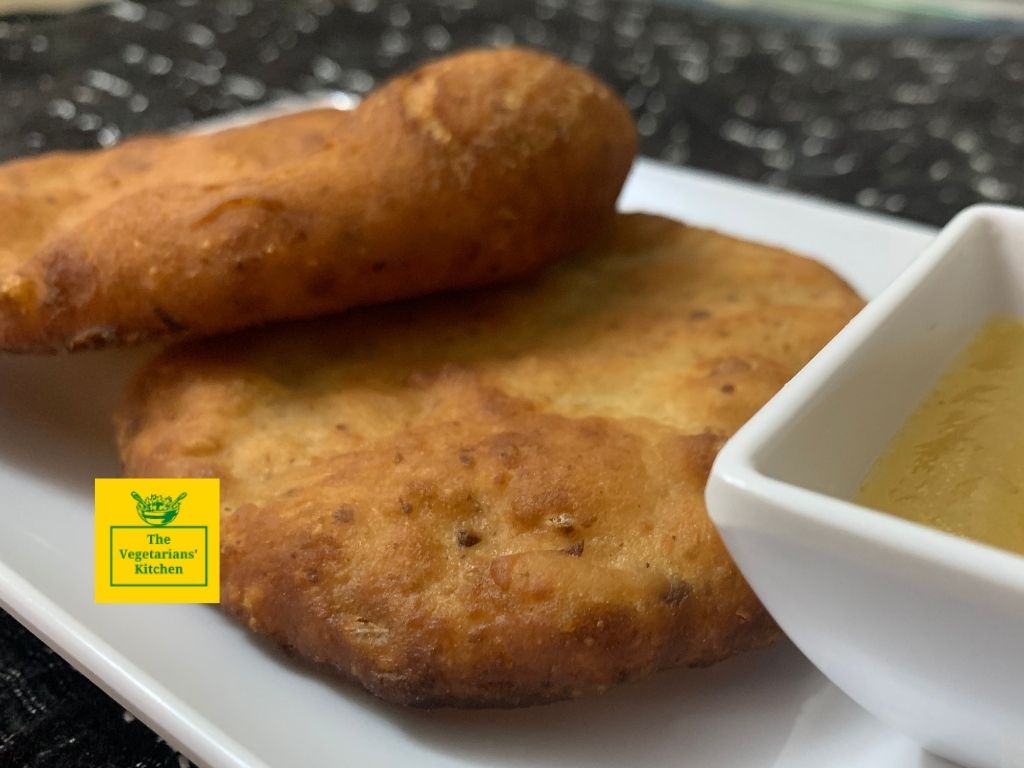 A close up of two vegan mekici served with apple jam.